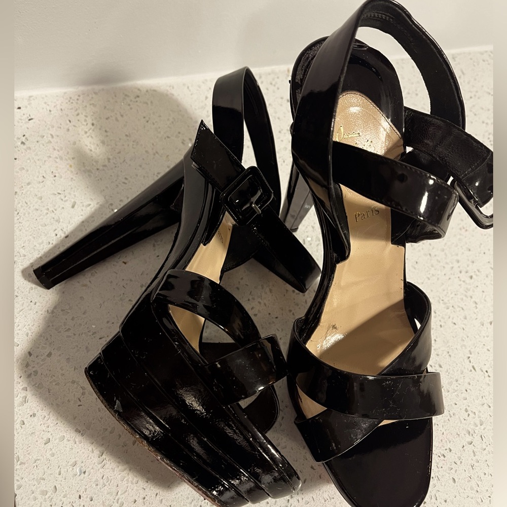 6in Louboutin toes out dress sandals.
